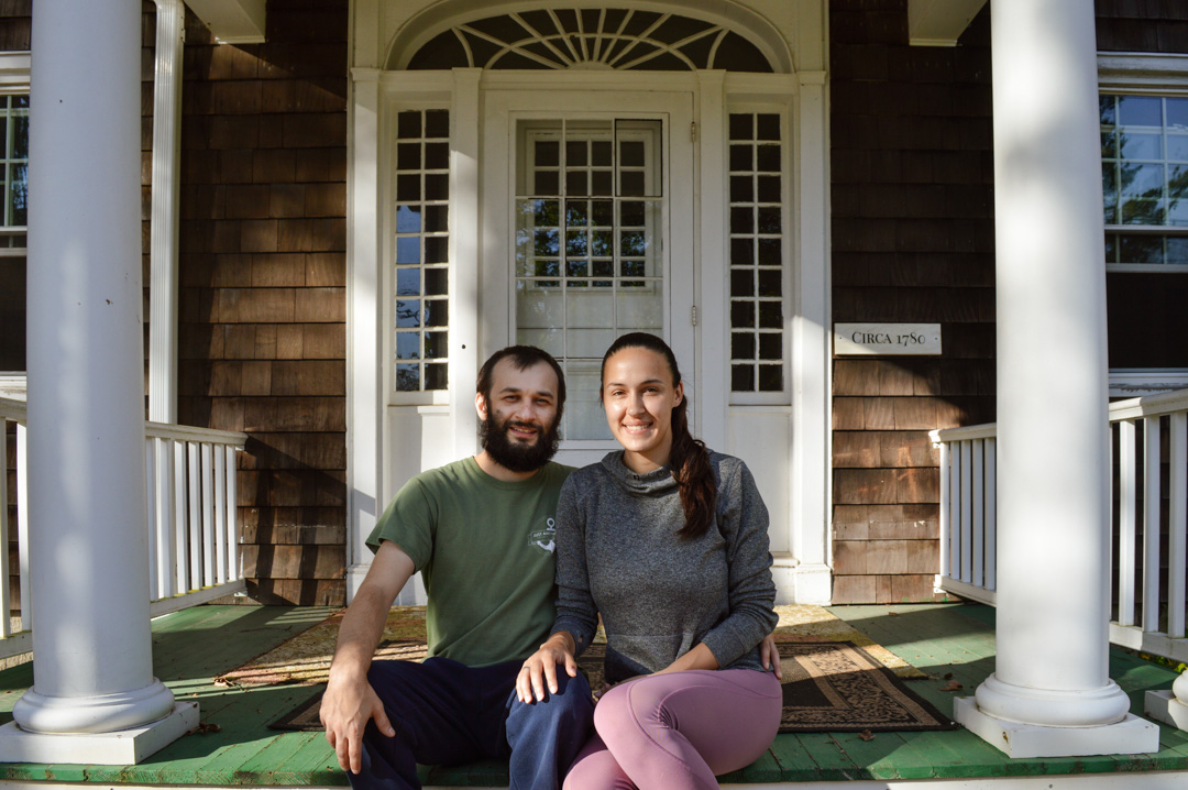 Seth & Shannon sitting on the front porch of Just Another House